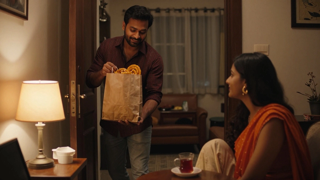 A man bringing jalebi home to his partner watching cricket on the floor.
